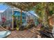 Enclosed pool area surrounded by lush tropical plants and a pergola for shade at 11450 Cypress Park St, Tampa, FL 33624