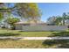 Lush backyard with a privacy fence and mature trees providing a peaceful outdoor setting at 11749 Summer Springs Dr, Riverview, FL 33579