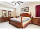 Cozy main bedroom with traditional furniture, ceiling fan, and a warm, inviting atmosphere at 11749 Summer Springs Dr, Riverview, FL 33579