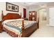 Inviting main bedroom with a full bed, ceiling fan, and ensuite bathroom access at 11749 Summer Springs Dr, Riverview, FL 33579