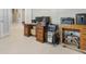 Home office setup with desk, computer monitors, and storage cabinets, ideal for remote work at 11749 Summer Springs Dr, Riverview, FL 33579
