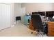 Spacious home office with dual monitors, printer and light blue cabinet storage at 11749 Summer Springs Dr, Riverview, FL 33579