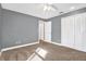 Bedroom featuring carpeted floors, gray walls, and double closet doors at 11933 72Nd Ave, Seminole, FL 33772