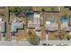 Aerial view of a property with a screened in pool, a shed, and a pool at 12256 Katherwood St, Spring Hill, FL 34608