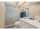 This bathroom features a single sink vanity, shower, and neutral wall color at 12256 Katherwood St, Spring Hill, FL 34608