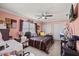 This bedroom features a ceiling fan, closet, and pink walls at 12256 Katherwood St, Spring Hill, FL 34608