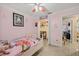 This bedroom features pink walls and an open closet at 12256 Katherwood St, Spring Hill, FL 34608