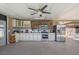 Well-equipped kitchenette with stainless steel appliances, ample cabinet space, and stylish tile backsplash at 12256 Katherwood St, Spring Hill, FL 34608
