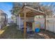 Covered outdoor kitchen with counter space and a sink, perfect for outdoor entertaining and food preparation at 12256 Katherwood St, Spring Hill, FL 34608