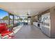Open patio showcasing the outdoor kitchen, dining and lounging area, and access to backyard at 12256 Katherwood St, Spring Hill, FL 34608
