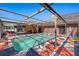 Outdoor pool featuring stylish tiling, ladder access and seamless transition to patio and entertaining space at 12256 Katherwood St, Spring Hill, FL 34608