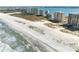 Breathtaking aerial view of a pristine beachfront with oceanfront condos and expansive sandy shores at 1270 Gulf Blvd # 905, Clearwater Beach, FL 33767