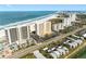 Stunning aerial view of oceanfront condos, showcasing its prime beach access and nearby waterway at 1270 Gulf Blvd # 905, Clearwater Beach, FL 33767
