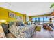 Bright bedroom with ocean view, comfortable seating, and stylish decor at 1270 Gulf Blvd # 905, Clearwater Beach, FL 33767