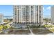 Oceanfront high-rise condo exterior featuring multiple balconies with a swimming pool and beach access at 1270 Gulf Blvd # 905, Clearwater Beach, FL 33767