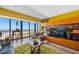 Living room with ocean view, stylish furnishings, and entertainment center at 1270 Gulf Blvd # 905, Clearwater Beach, FL 33767