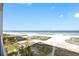 Scenic ocean view from a balcony showing sandy beaches, palm trees, and blue skies at 1270 Gulf Blvd # 905, Clearwater Beach, FL 33767