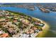 Luxury waterfront property with beach access and lush landscaping, located in a desirable coastal community at 1314 Jumana Loop, Apollo Beach, FL 33572