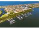 Scenic aerial view of a marina, highlighting boat docks and waterfront access in a vibrant coastal neighborhood at 1314 Jumana Loop, Apollo Beach, FL 33572