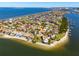 Spectacular aerial view of a coastal community, showcasing waterfront homes, beaches, and scenic surroundings at 1314 Jumana Loop, Apollo Beach, FL 33572