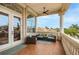 Outdoor balcony with comfortable seating, tiled floors, and picturesque neighborhood views at 1314 Jumana Loop, Apollo Beach, FL 33572