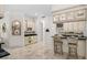 Entertainment area featuring a bar with seating, custom cabinets, and storage for beverages and glassware at 1314 Jumana Loop, Apollo Beach, FL 33572