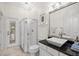 Bathroom featuring an expansive shower, square sink, and modern light fixtures at 1314 Jumana Loop, Apollo Beach, FL 33572