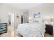 Bright bedroom features tile floors, a closet, and a flamingo-themed pillow at 1314 Jumana Loop, Apollo Beach, FL 33572