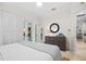 Bright bedroom featuring access to the pool, light walls, and neutral toned decor at 1314 Jumana Loop, Apollo Beach, FL 33572