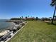 Beautiful waterfront community area with playground, lush lawn, and gorgeous landscaping at 1314 Jumana Loop, Apollo Beach, FL 33572