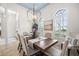 Charming dining room with shutters, chandelier, and a stylish table setting at 1314 Jumana Loop, Apollo Beach, FL 33572