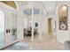 Elegant dining room with high ceilings, detailed columns, and seamless transition to other spaces at 1314 Jumana Loop, Apollo Beach, FL 33572