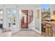 Bright foyer showcasing a unique spiral staircase and access to a covered patio at 1314 Jumana Loop, Apollo Beach, FL 33572