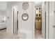 Hallway with access to and walk in closets with custom shelving at 1314 Jumana Loop, Apollo Beach, FL 33572