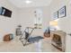 Bright home gym with neutral walls and flooring, and large windows for a view while exercising at 1314 Jumana Loop, Apollo Beach, FL 33572