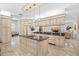 Spacious kitchen featuring a large island, granite countertops, and stylish pendant lighting at 1314 Jumana Loop, Apollo Beach, FL 33572