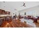 Expansive living room with open layout, wood floors, large windows, and ample seating at 1314 Jumana Loop, Apollo Beach, FL 33572