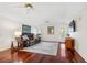 Relaxing living room with wood floors, neutral rug, ceiling fans, and stylish furniture at 1314 Jumana Loop, Apollo Beach, FL 33572
