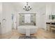 Bright bathroom featuring a large tub, a walk-in shower, and vanity at 1314 Jumana Loop, Apollo Beach, FL 33572