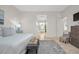 Bright main bedroom featuring access to the main bathroom at 1314 Jumana Loop, Apollo Beach, FL 33572