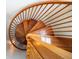 Beautiful top-down view of a wooden spiral staircase featuring gorgeous craftsmanship at 1314 Jumana Loop, Apollo Beach, FL 33572