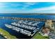 Beautiful aerial view of a marina, showcasing numerous boats docked and waterfront properties in a desirable location at 140 Riviera Dunes Way # 404, Palmetto, FL 34221