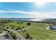 Expansive aerial view of vacant lot with lush green space and beautiful views of the intercoastal waterway at 140 Riviera Dunes Way # 404, Palmetto, FL 34221