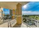 Spacious balcony with seating offers beautiful views of the surrounding landscape and clear, sunny skies at 140 Riviera Dunes Way # 404, Palmetto, FL 34221