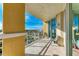 Spacious balcony with outdoor seating and views of the city and ocean at 140 Riviera Dunes Way # 404, Palmetto, FL 34221
