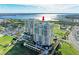 Striking exterior elevation of the condominium building with beautiful views of the marina at 140 Riviera Dunes Way # 404, Palmetto, FL 34221