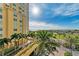 The manicured landscaping enhances the curb appeal of this building, complete with a circular drive at 140 Riviera Dunes Way # 404, Palmetto, FL 34221
