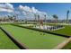 Community game area with a bocce court and giant chessboard, offering outdoor fun for everyone at 140 Riviera Dunes Way # 404, Palmetto, FL 34221