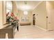 Hallway featuring elegant design, a decorative mirror, elevator access, and beautiful artwork at 140 Riviera Dunes Way # 404, Palmetto, FL 34221