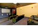 This home theater includes plush seating and a large screen for an immersive entertainment experience at 140 Riviera Dunes Way # 404, Palmetto, FL 34221